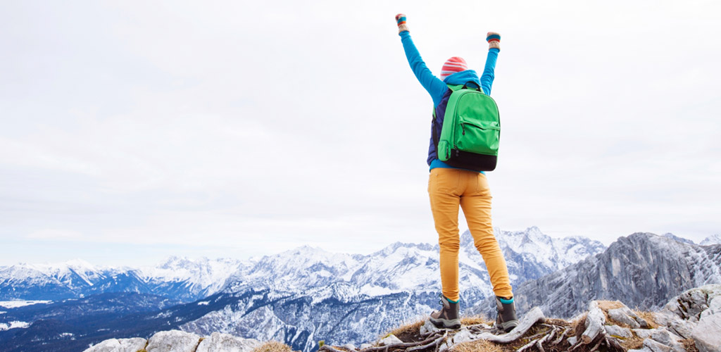 climber at top of mountain