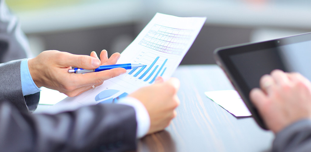 hands pointing at a paper