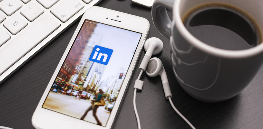 iPhone next to a coffee mug