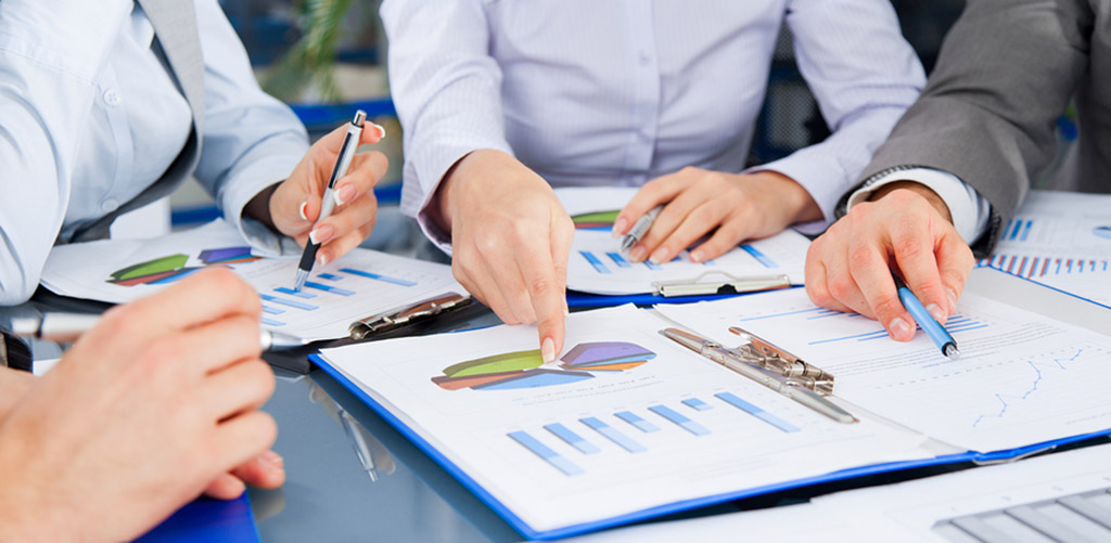 business person pointing at an information graph