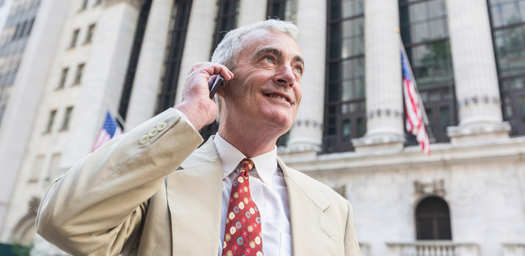 old salesman on a phone
