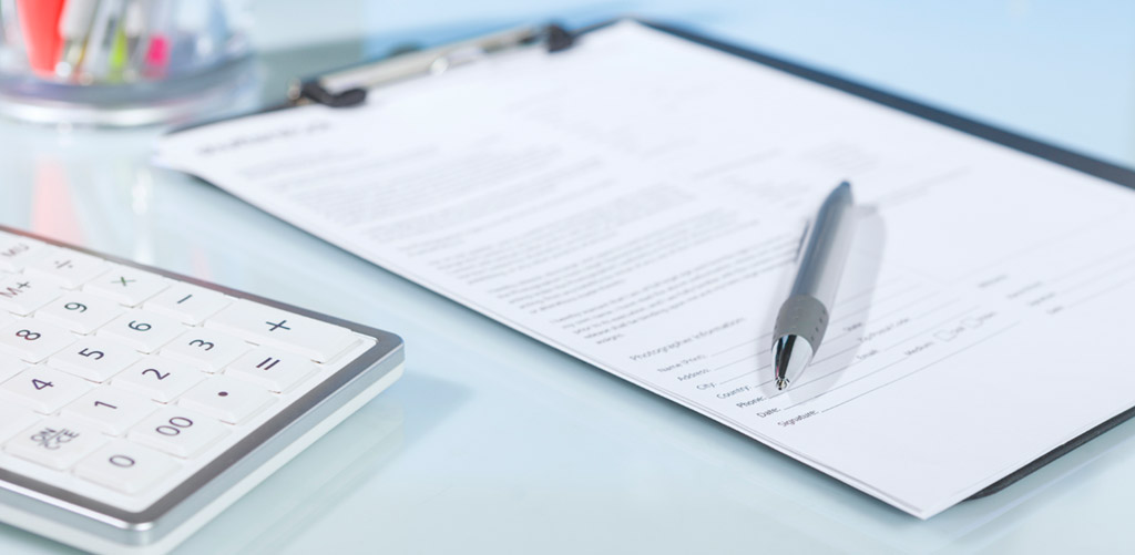 contract with pen on top