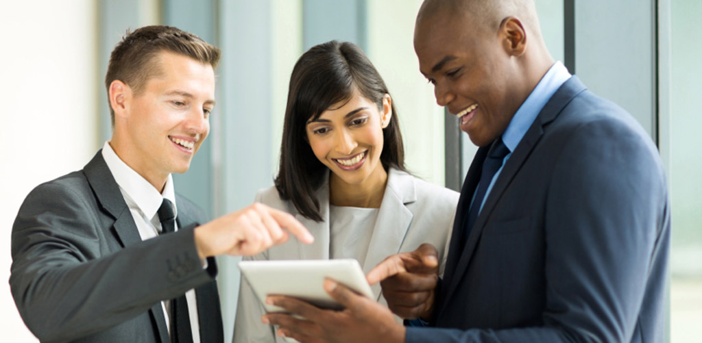 business people on an iPad