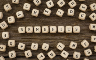 Word BENEFITS written on wood block,stock image